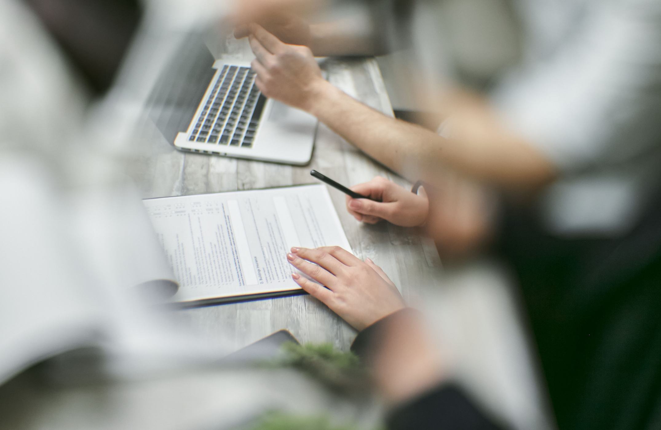Two people working through a document together