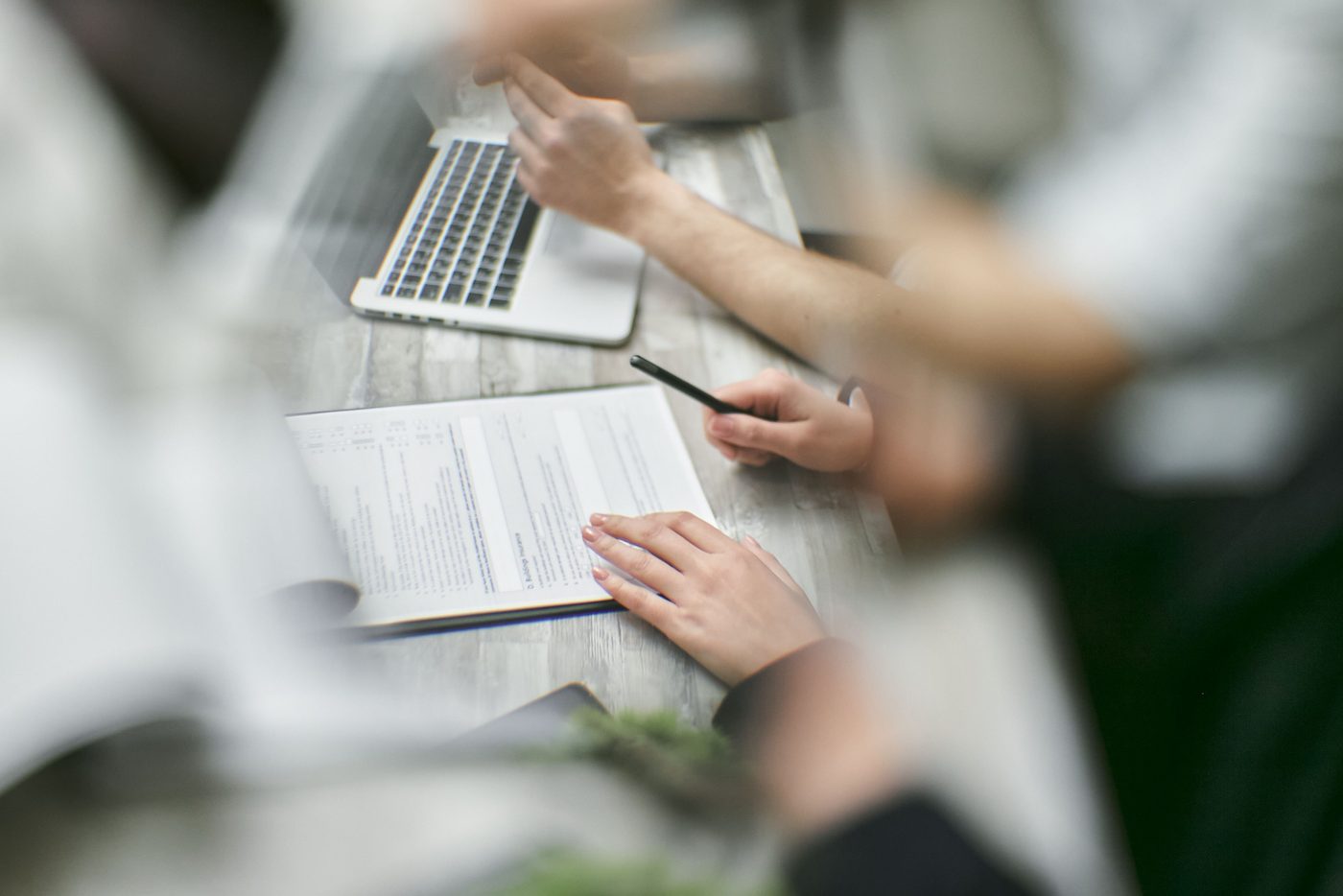 Two people working through a document together