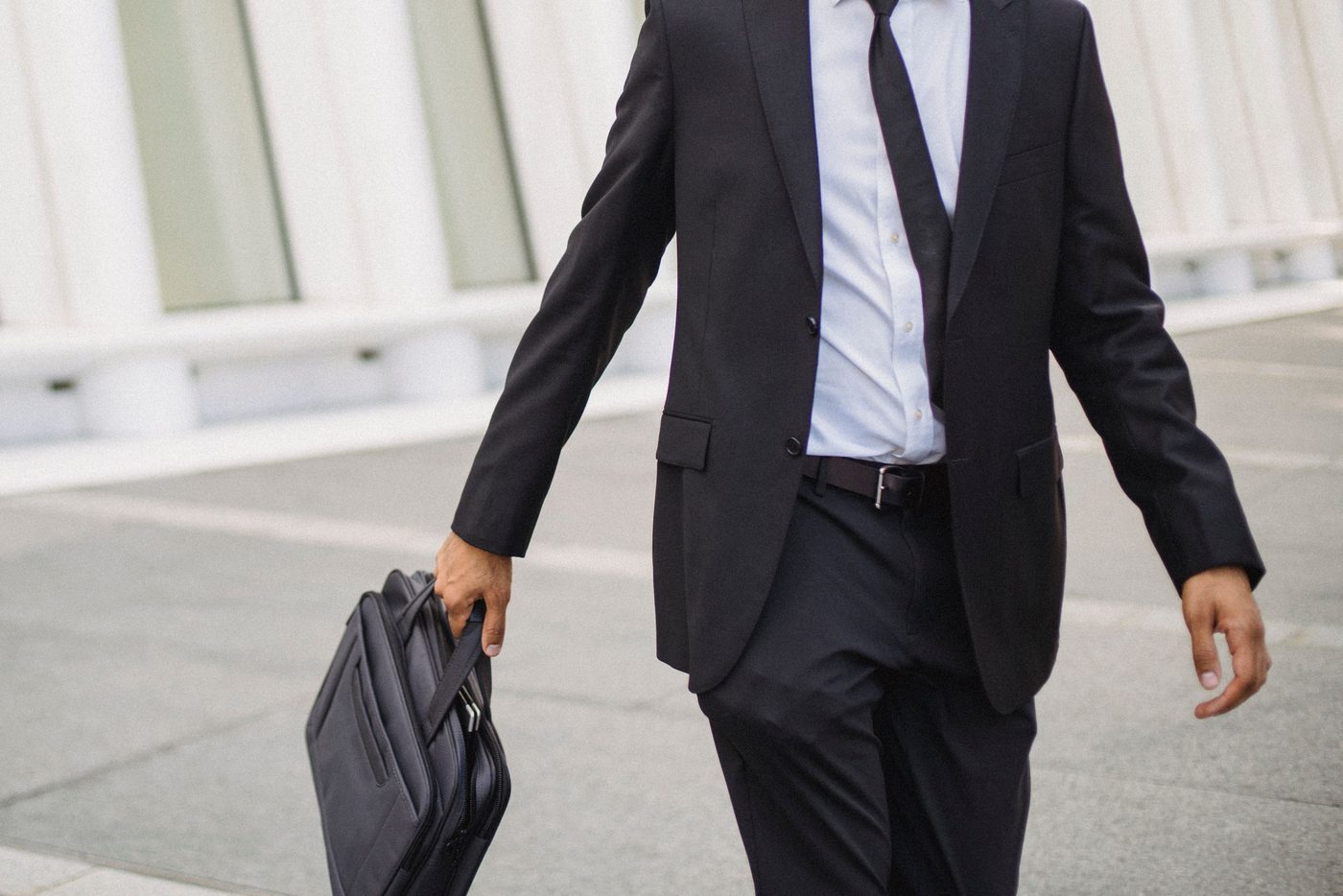 Walking to work, briefcase in hand